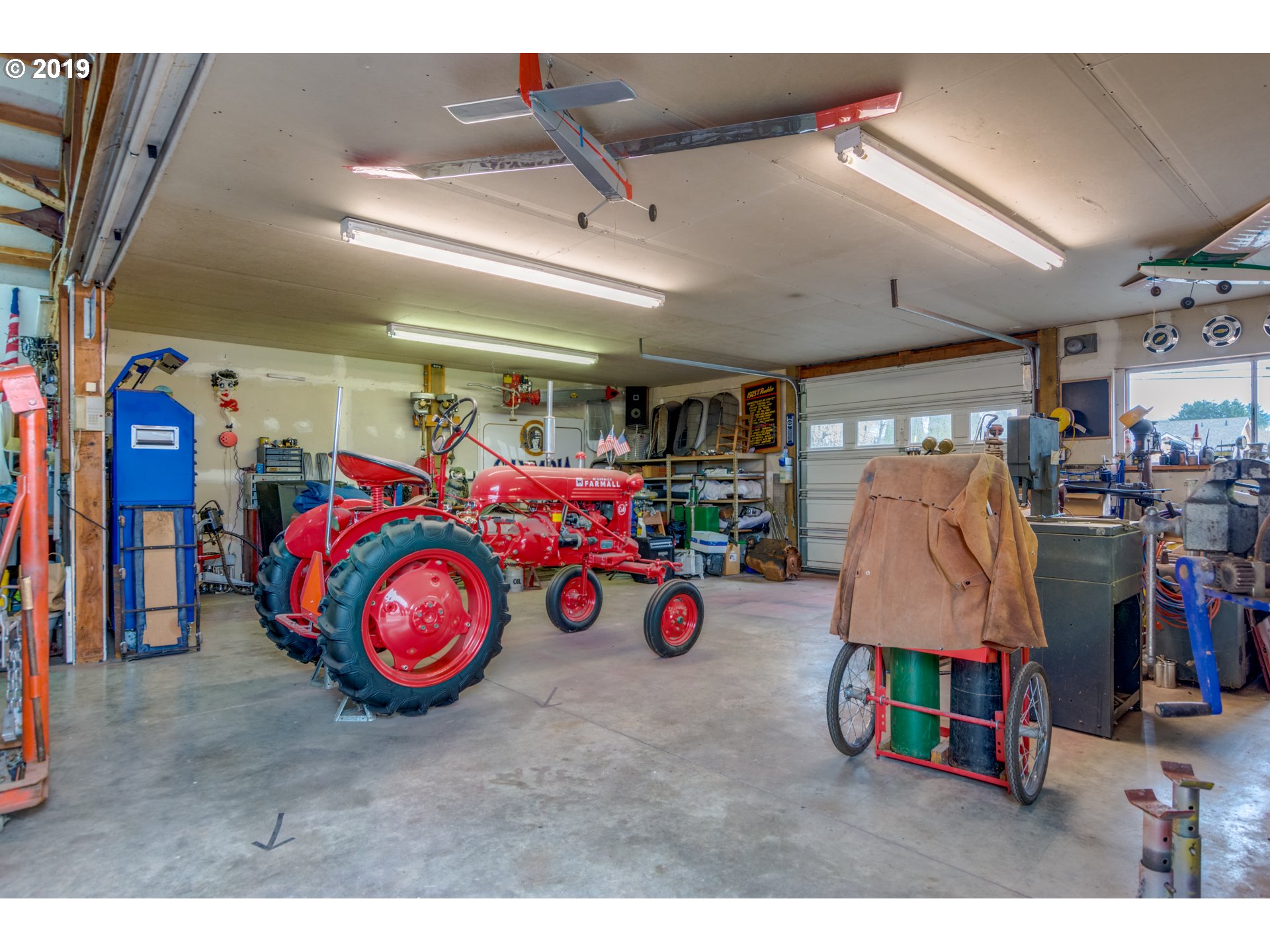 11379 Southwest Spring Hill Road Gaston, OR 97119 - Photo 26 of 28 a view of garage with a bike and car