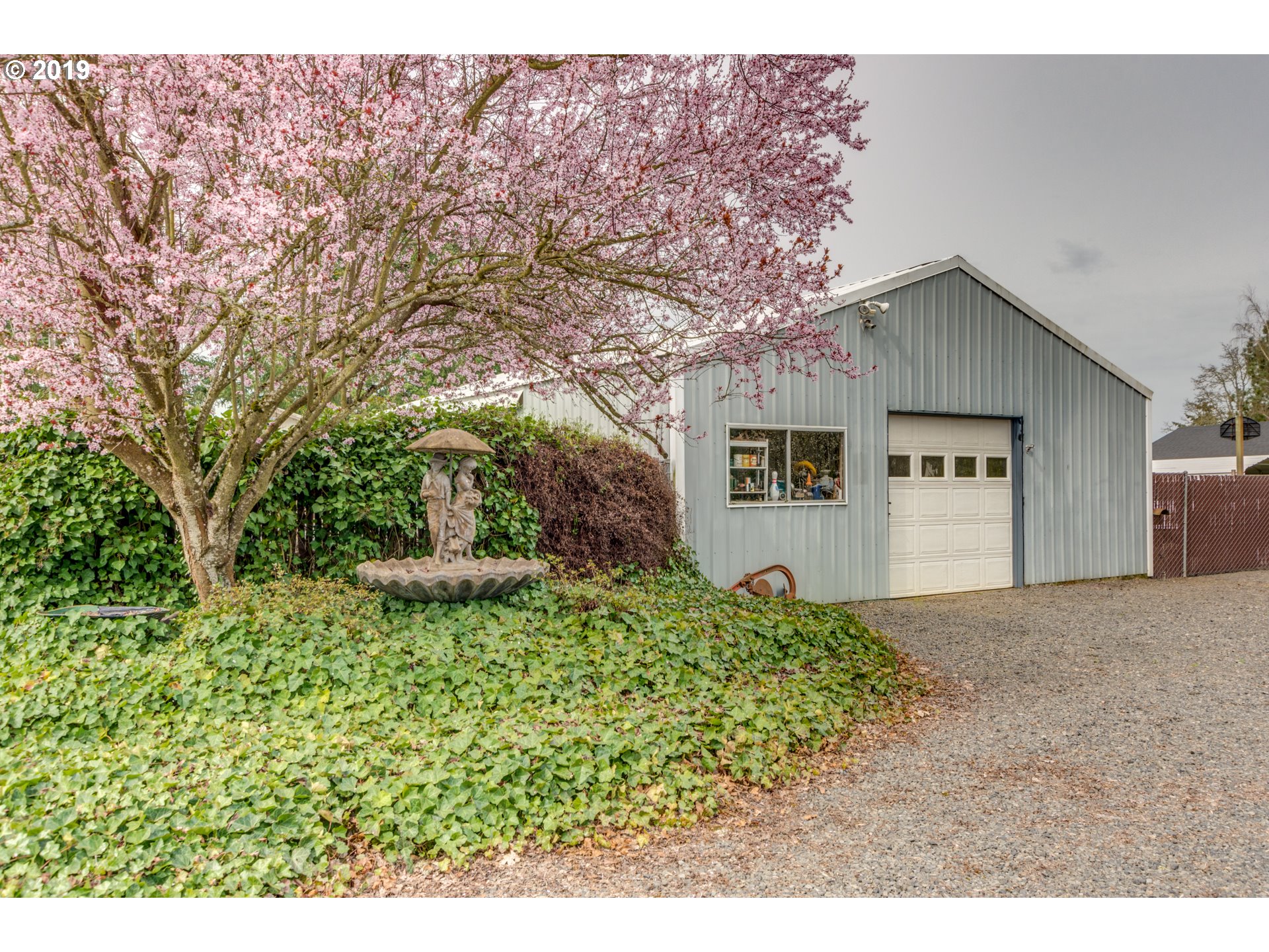 11379 Southwest Spring Hill Road Gaston, OR 97119 - Photo 3 of 28 a view of a house with a yard and potted plants