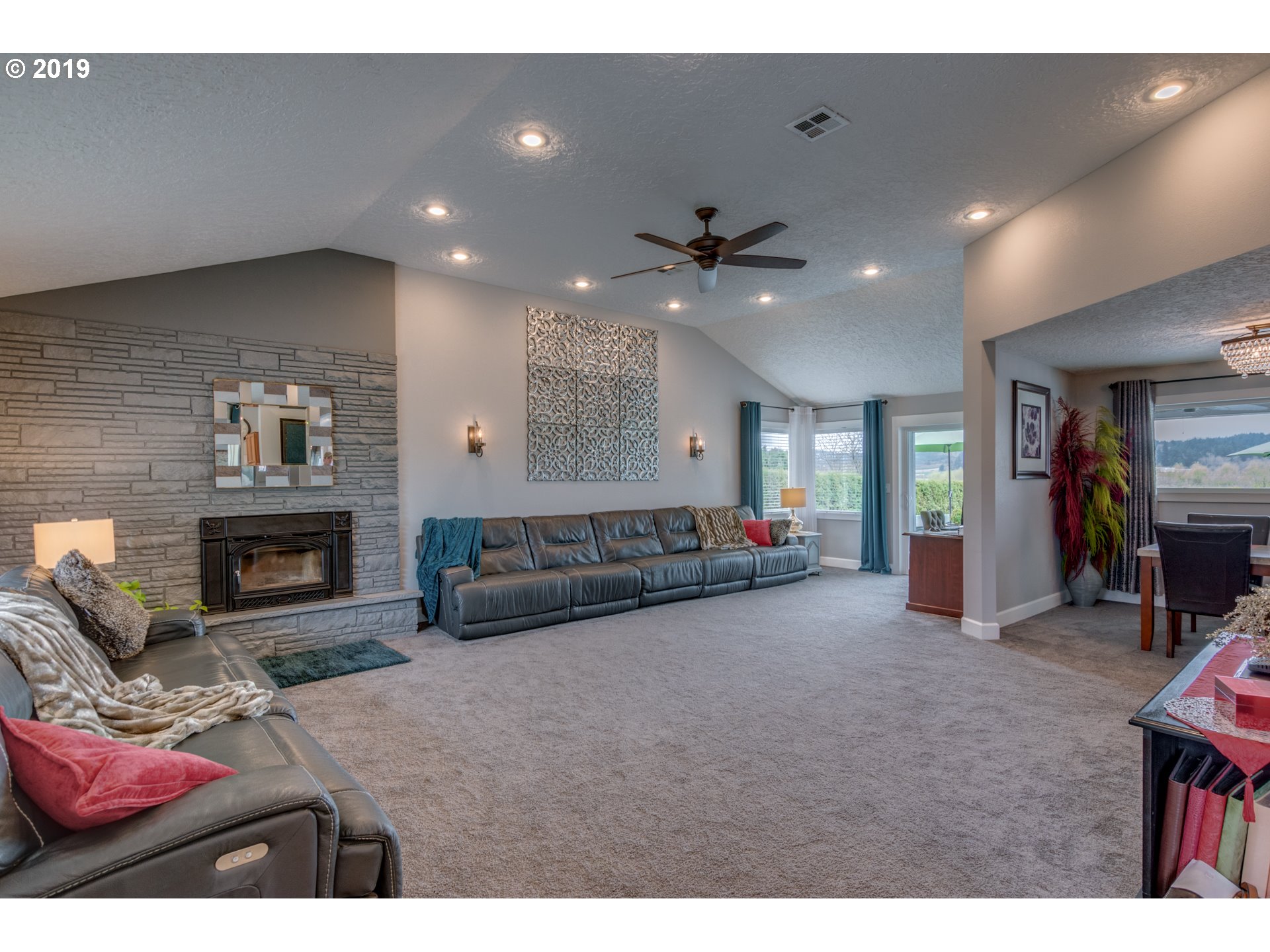 11379 Southwest Spring Hill Road Gaston, OR 97119 - Photo 5 of 28 a living room with furniture and a fireplace