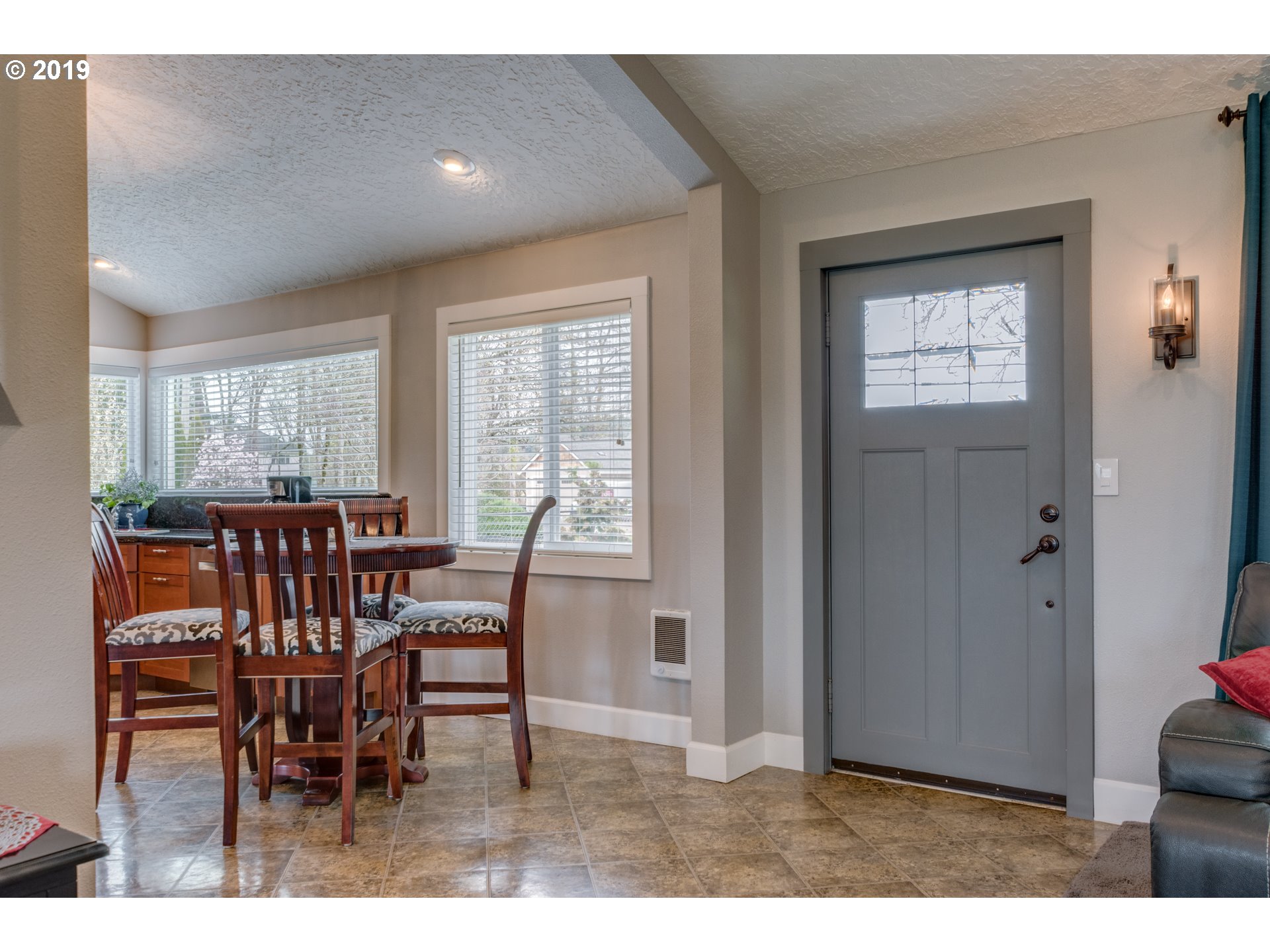 11379 Southwest Spring Hill Road Gaston, OR 97119 - Photo 7 of 28 a view of a dining room with furniture and chandelier