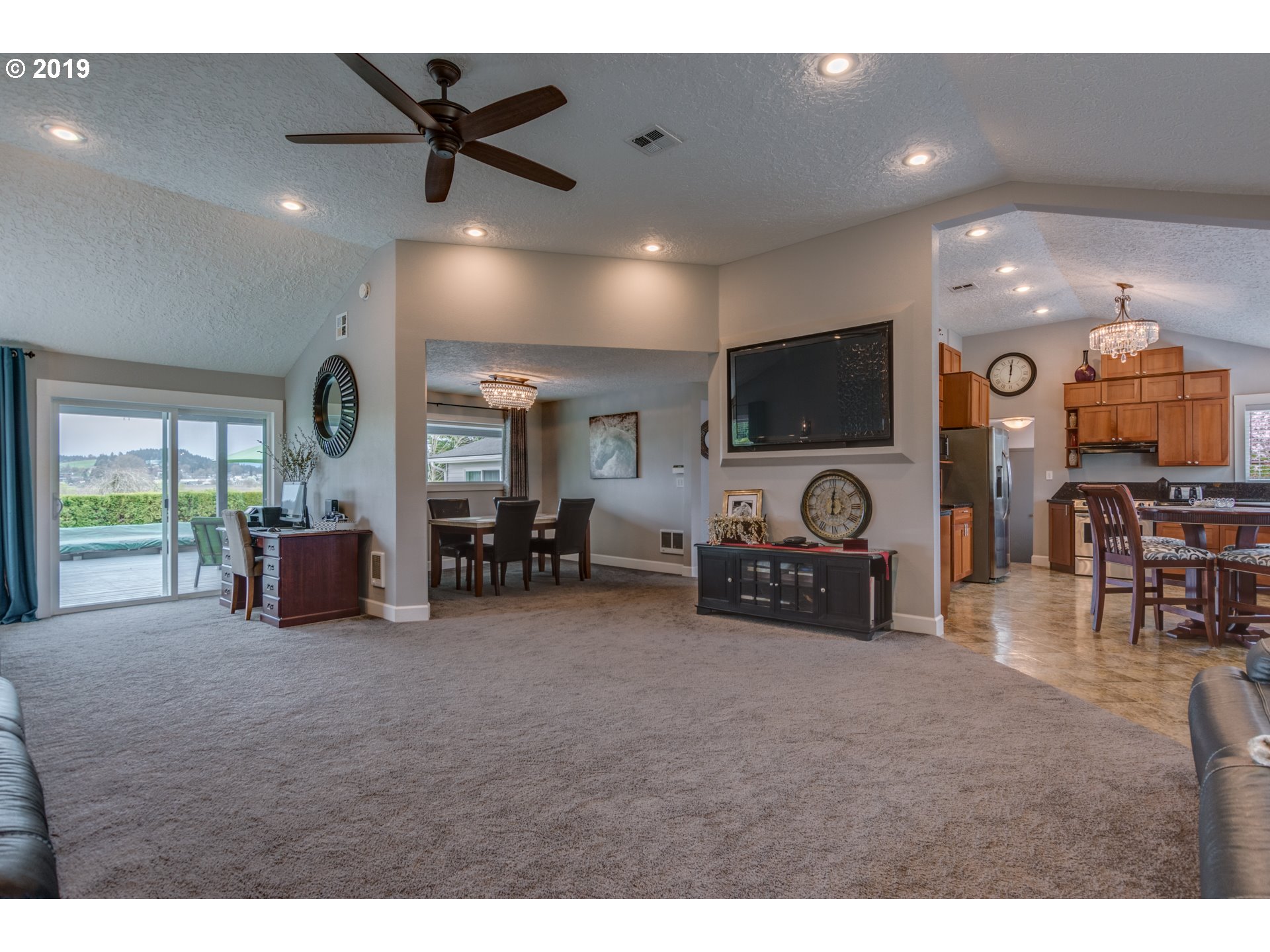11379 Southwest Spring Hill Road Gaston, OR 97119 - Photo 8 of 28 a living room with furniture and a flat screen tv