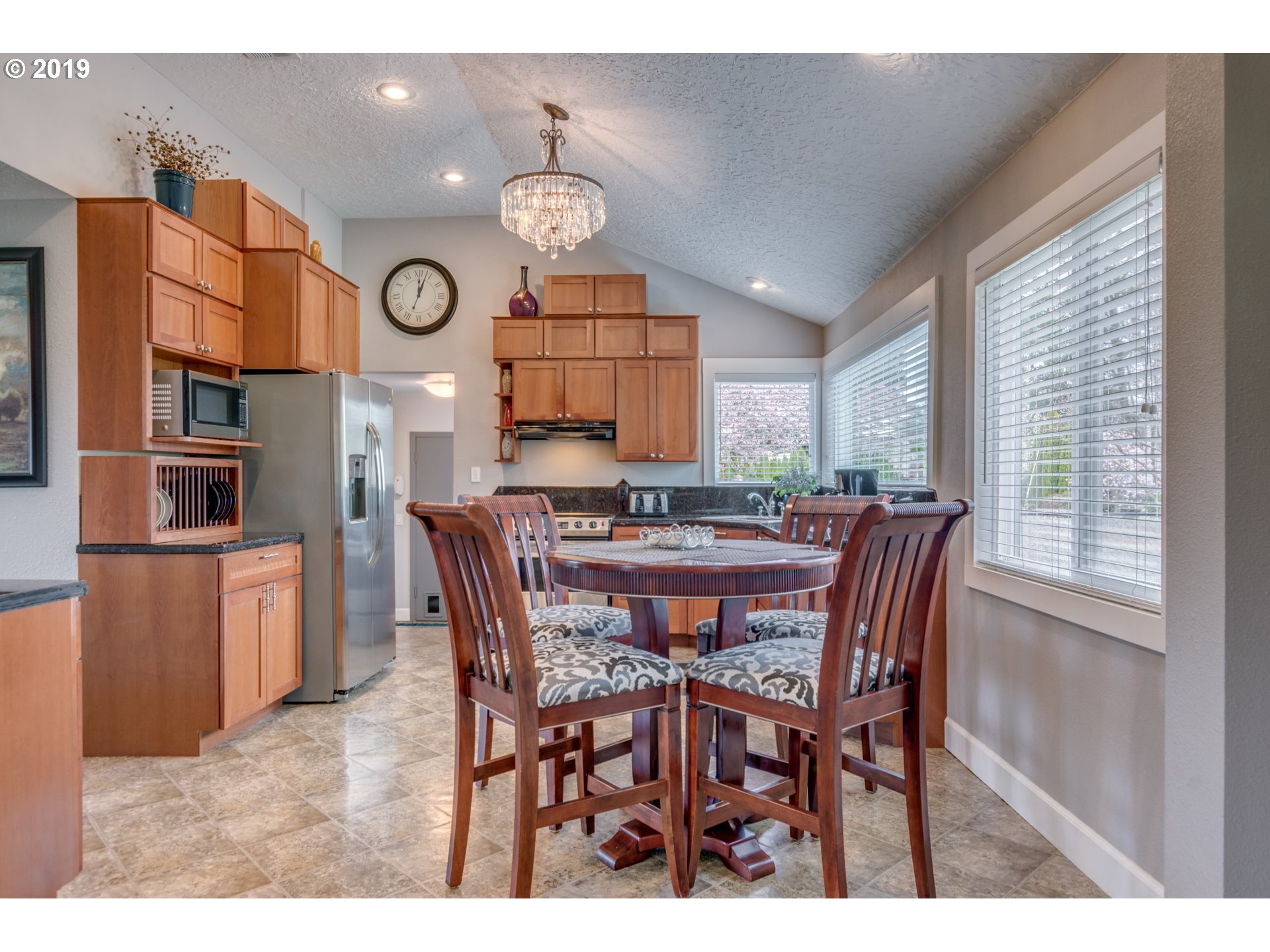 11379 Southwest Spring Hill Road Gaston, OR 97119 - Photo 10 of 28 a view of a dining room and livingroom with furniture window and wooden floor