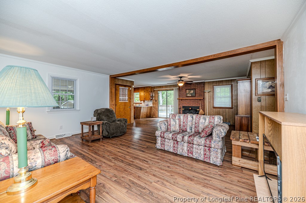 3384 Goldston Glendon Road Goldston, NC 27252 - Photo 7 of 47 a living room with furniture and a wooden floor