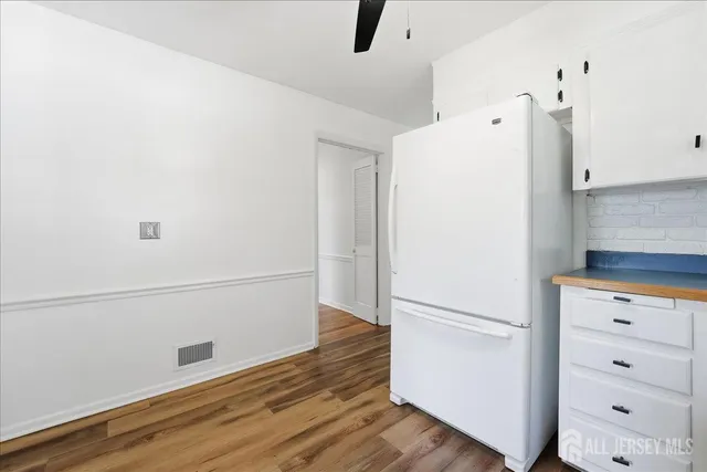 a view of kitchen with wooden floor