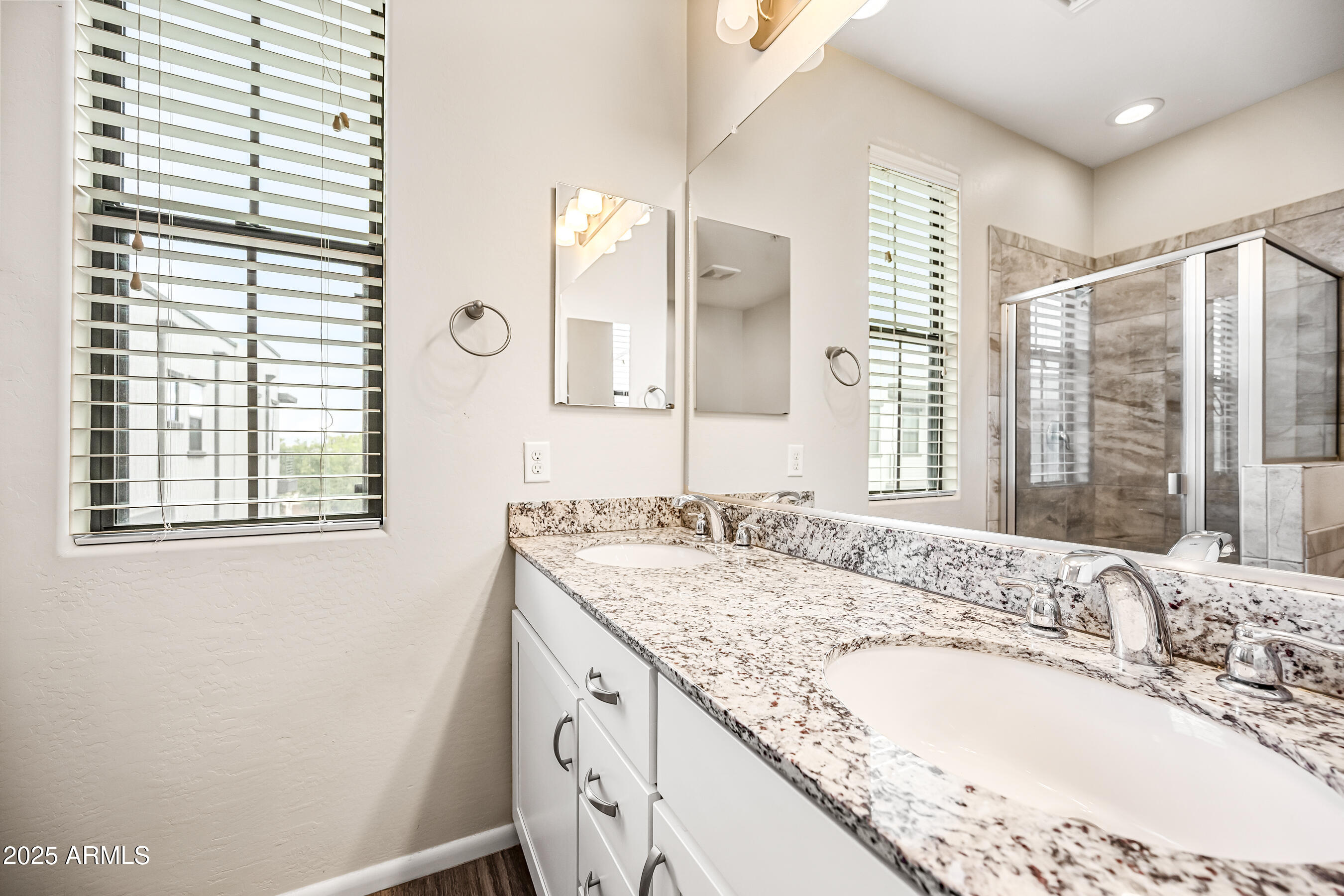 2090 South Dorsey Lane, Unit 1004 Tempe, AZ 85282 - Photo 22 of 31 a bathroom with a granite countertop sink and a large mirror