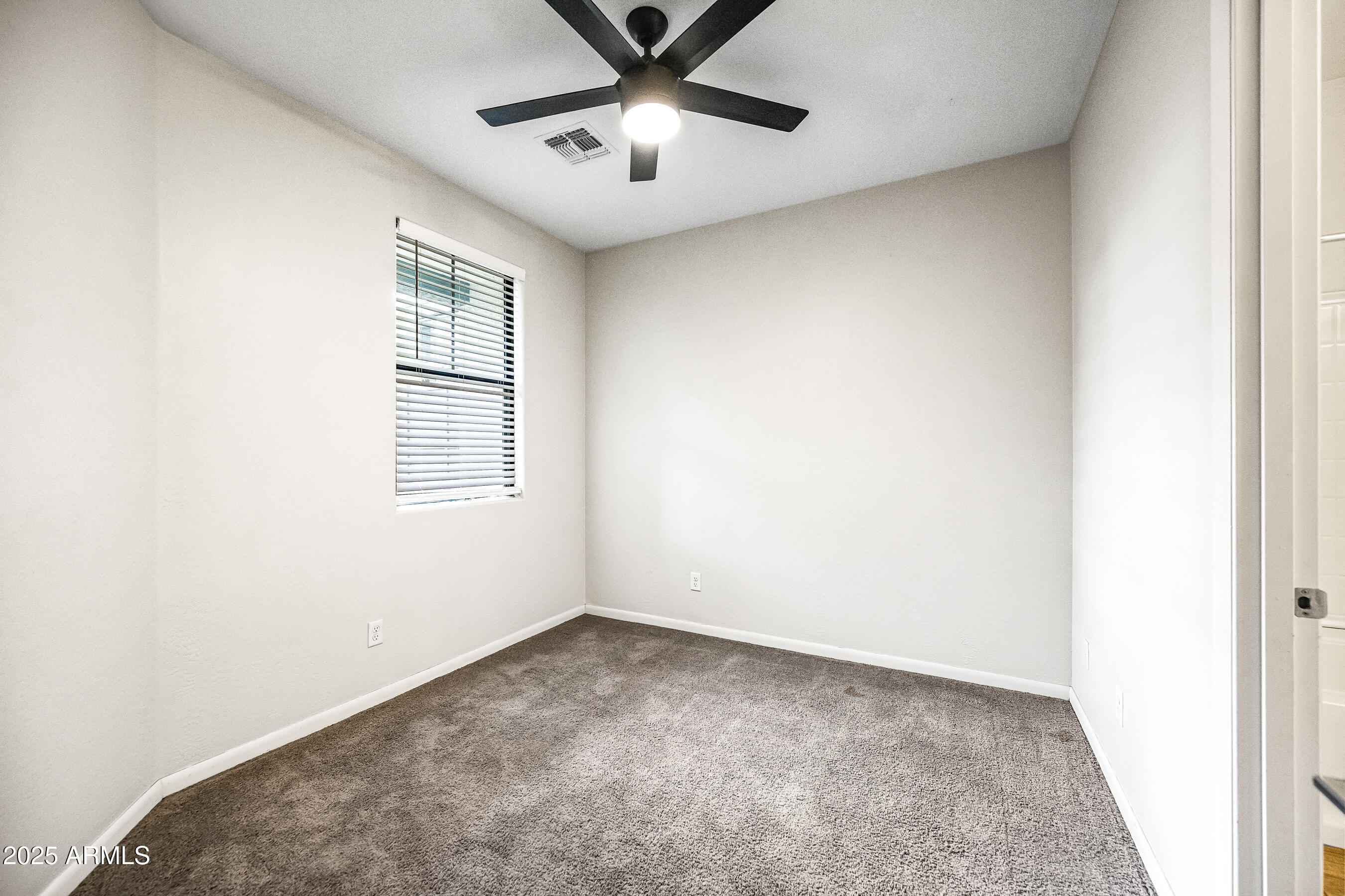2090 South Dorsey Lane, Unit 1004 Tempe, AZ 85282 - Photo 3 of 31 a view of an empty room with a window