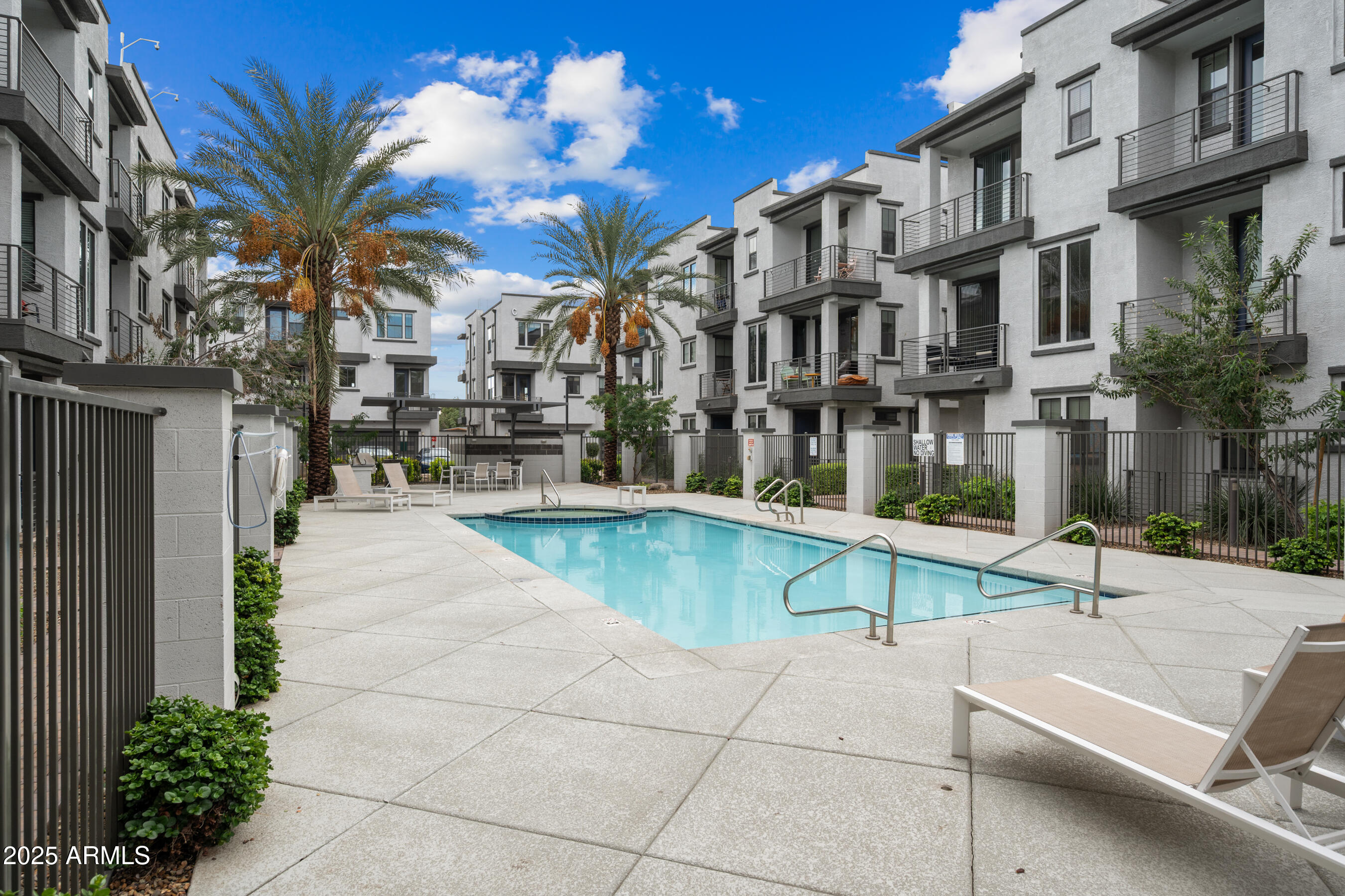 2090 South Dorsey Lane, Unit 1004 Tempe, AZ 85282 - Photo 31 of 31 a swimming pool with outdoor seating and yard