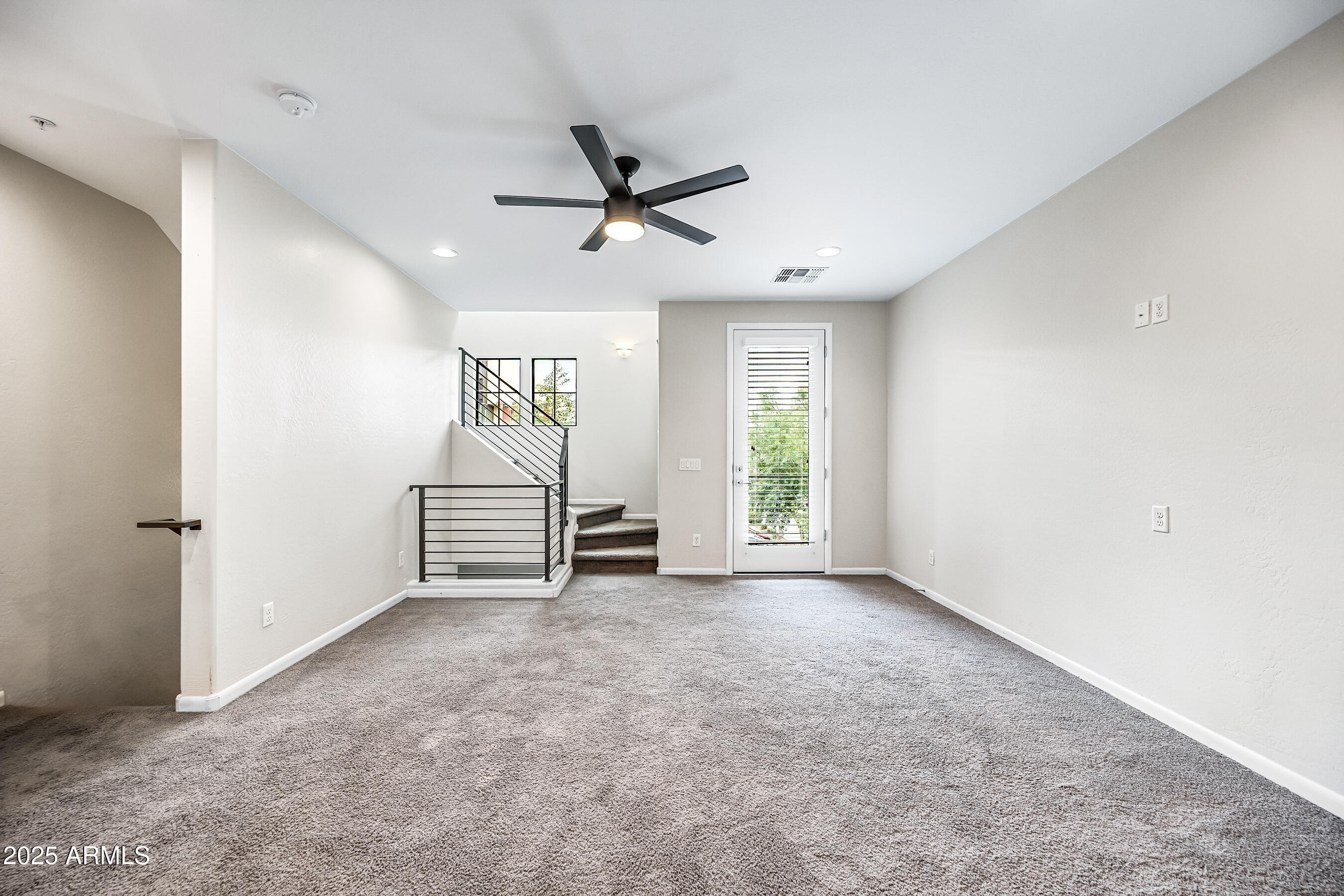 2090 South Dorsey Lane, Unit 1004 Tempe, AZ 85282 - Photo 7 of 31 a view of a livingroom with a ceiling fan and window