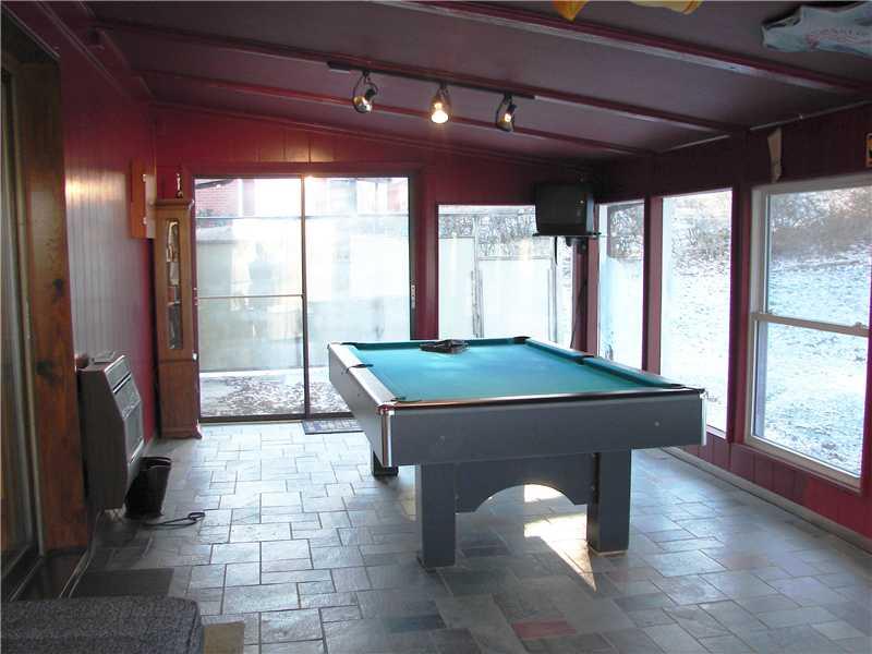 127 Parkview Road Pittsburgh, PA 15237 - Photo 12 of 25 Family Room. This main level all seasons/family/recreation room comes complete with a natural gas heating system, walk out to rear yard and a pool table for your immediate enjoyment!!