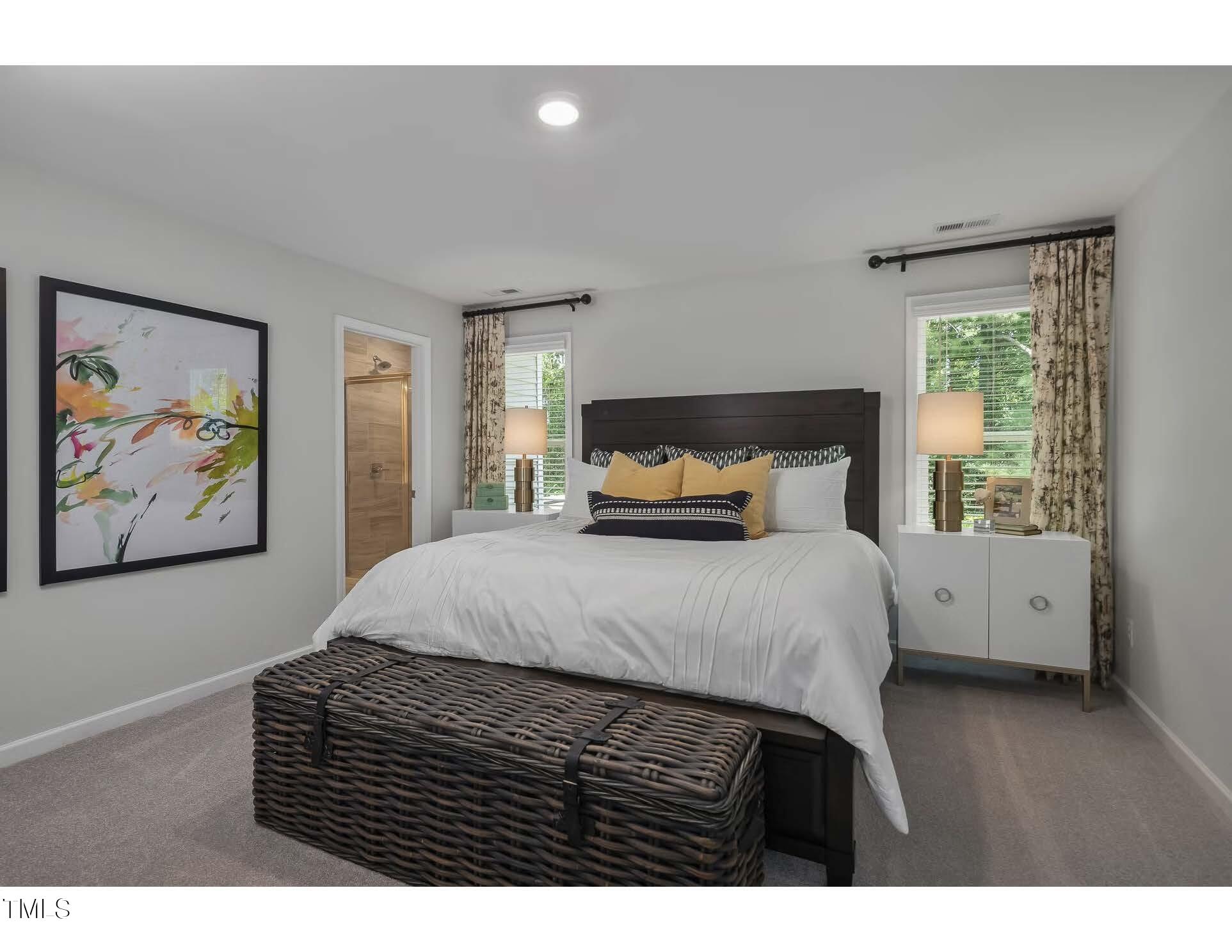 69 White Azalea Way Benson, NC 27504 - Photo 6 of 17 a bedroom with a bed and wooden floor