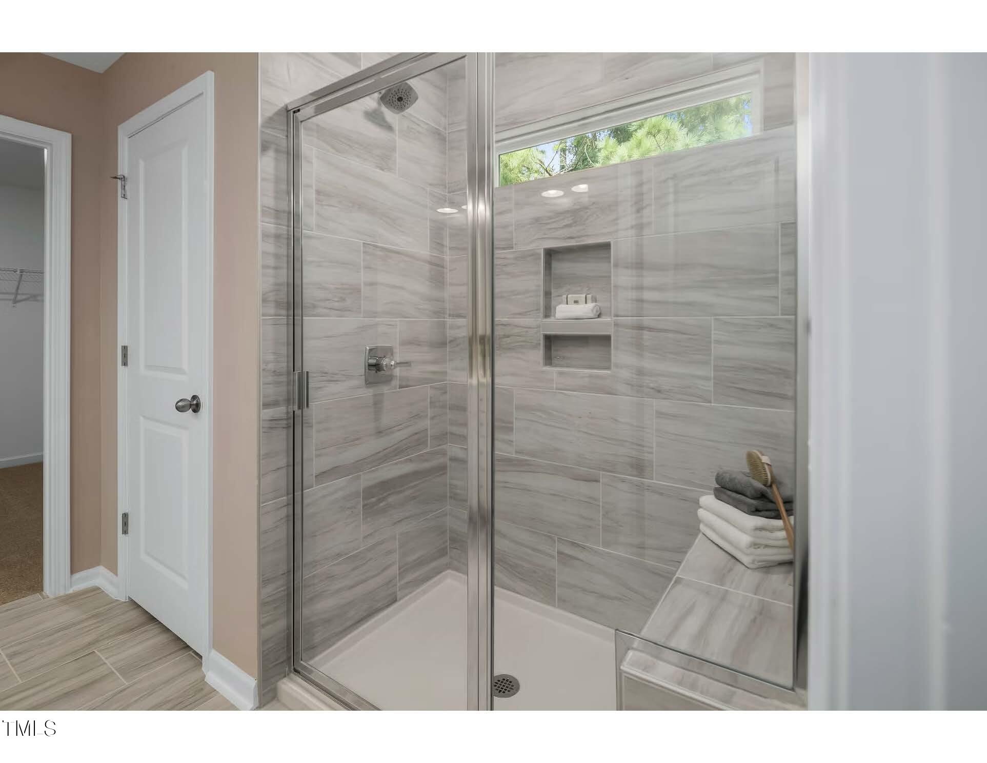 69 White Azalea Way Benson, NC 27504 - Photo 8 of 17 a bathroom with a shower