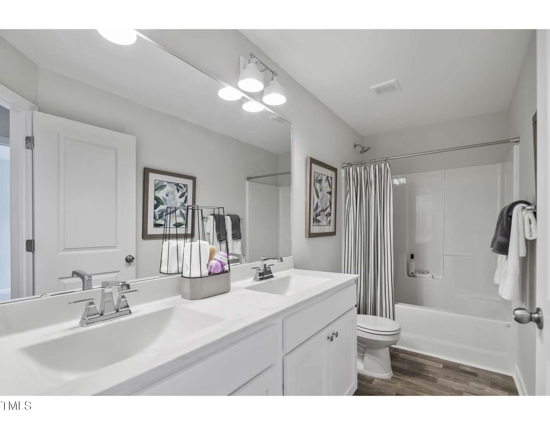 69 White Azalea Way Benson, NC 27504 - Photo 10 of 17 a bathroom with a sink vanity granite and a mirror