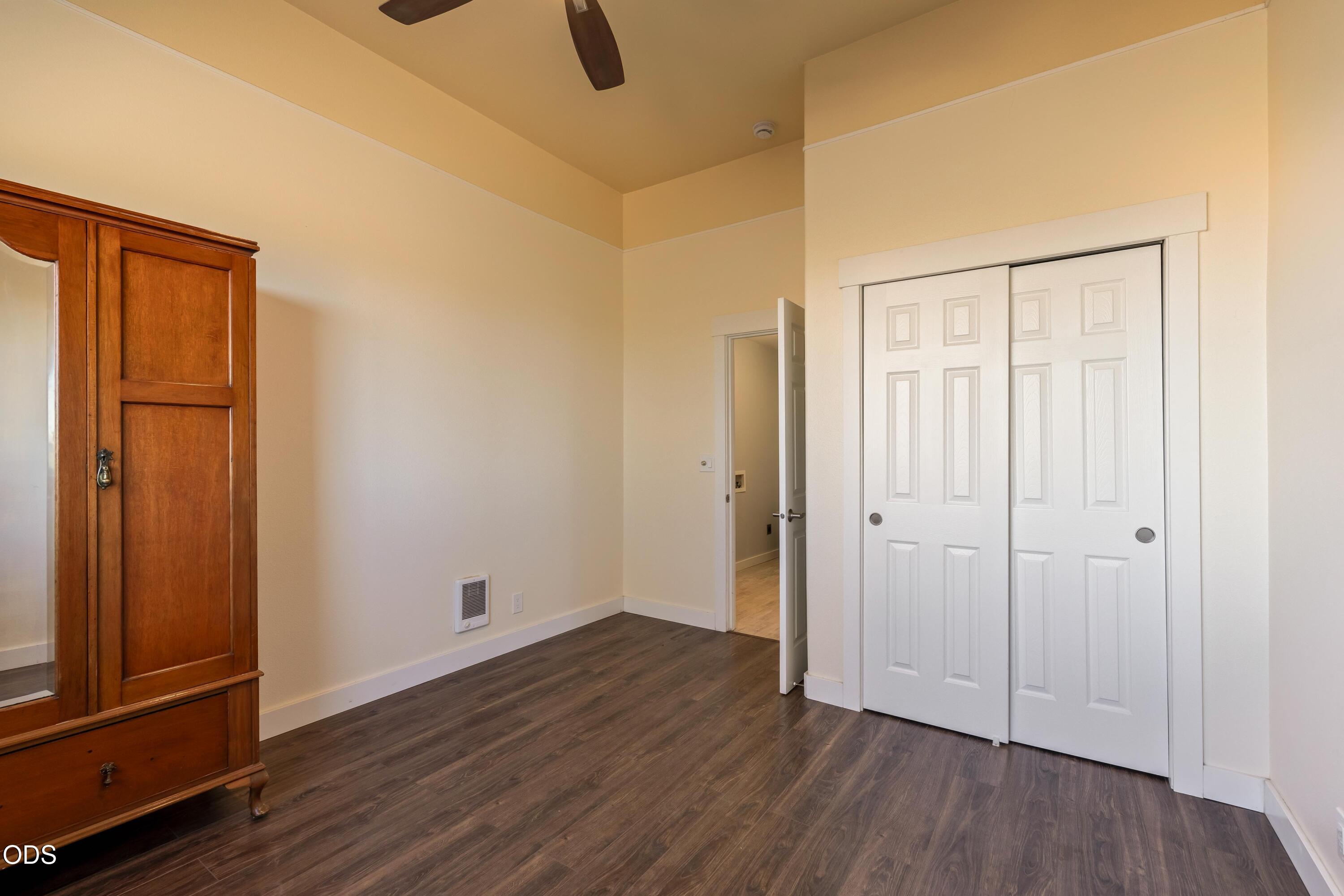 13753 South Sego Lily Road Powell Butte, OR 97753 - Photo 26 of 46 a view of an empty room with wooden floor