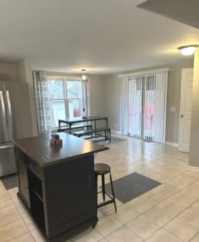 a kitchen with stainless steel appliances granite countertop a sink counter space and a window