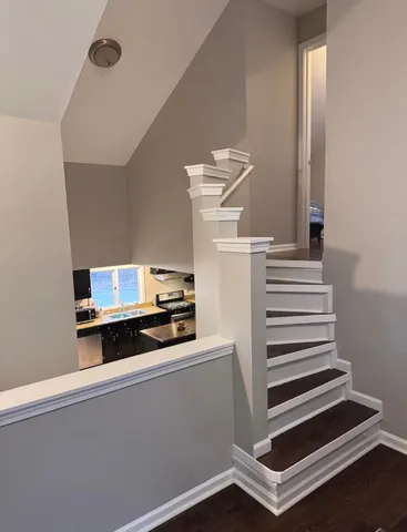 a room with a stove and a microwave