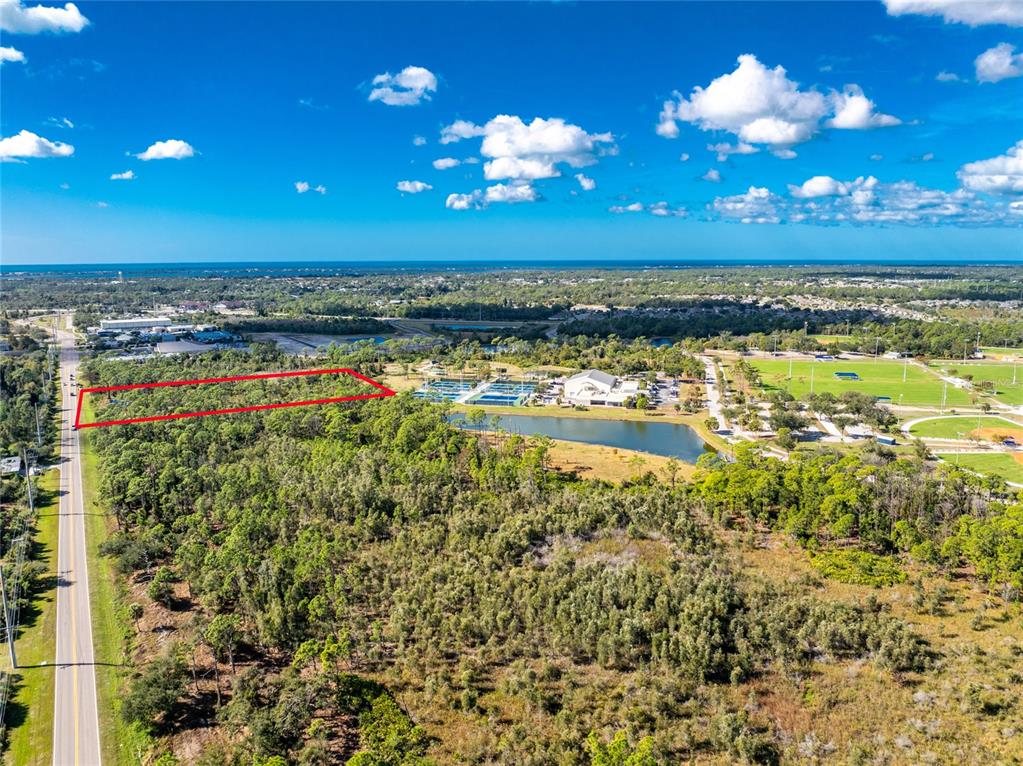 1060 South River Road Englewood, FL 34223 - Photo 11 of 14 a view of a room with a swimming pool fire place and open kitchen view