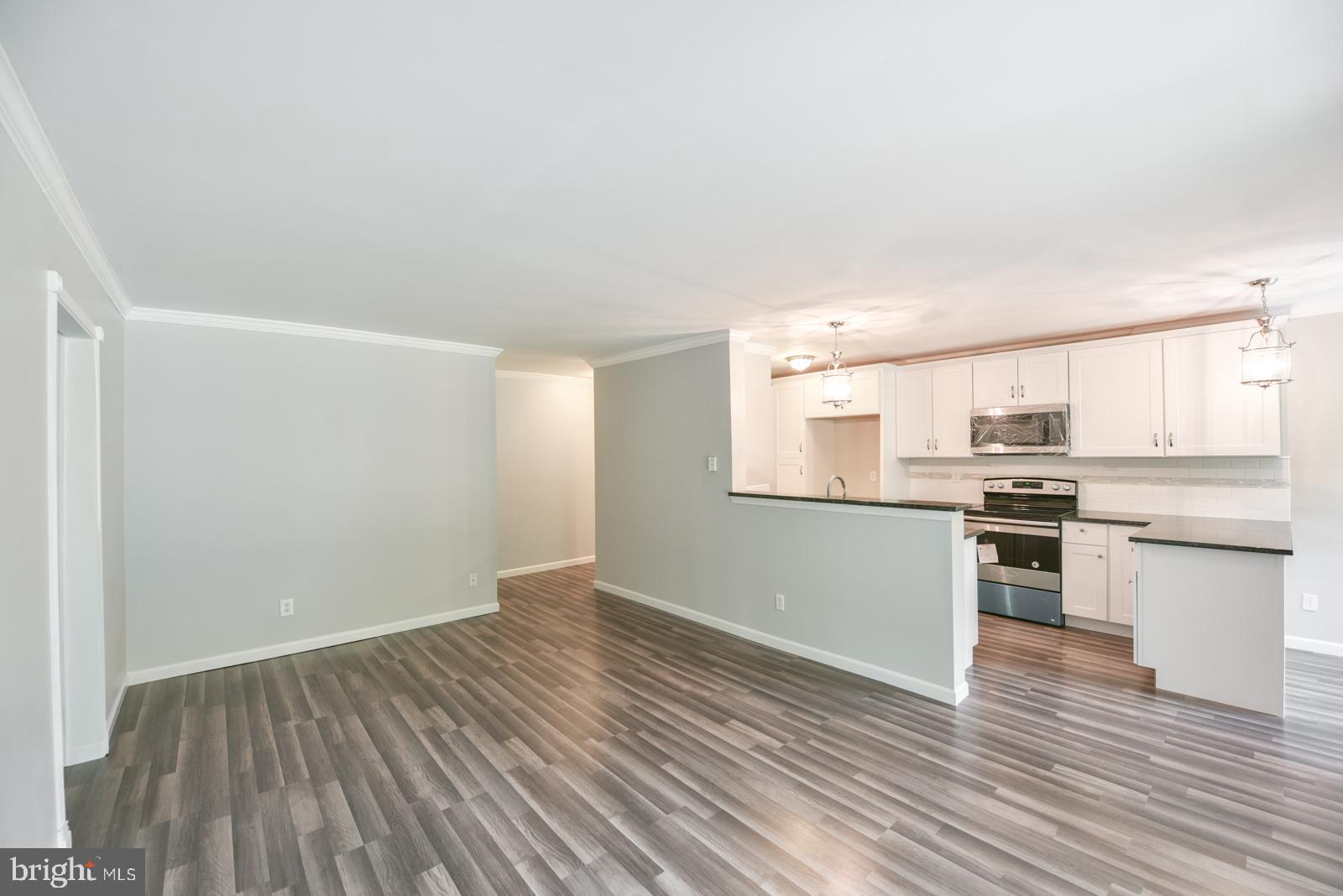200 Campbell Circle, Unit E7 Downingtown, PA 19335 - Photo 8 of 28 Living into Kitchen