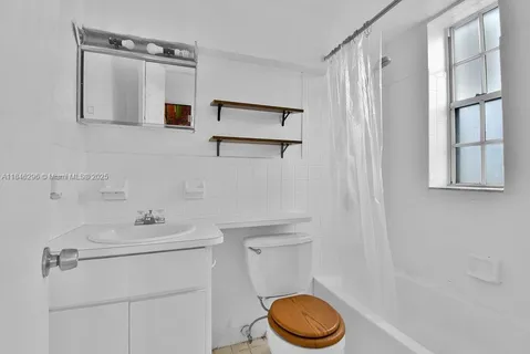 a bathroom with a sink a toilet and vanity