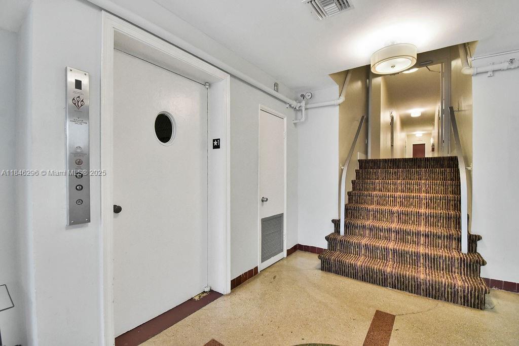 1051 Meridian Avenue, Unit 1C Miami Beach, FL 33139 - Photo 15 of 27 a bathroom with a double vanity sink and a mirror