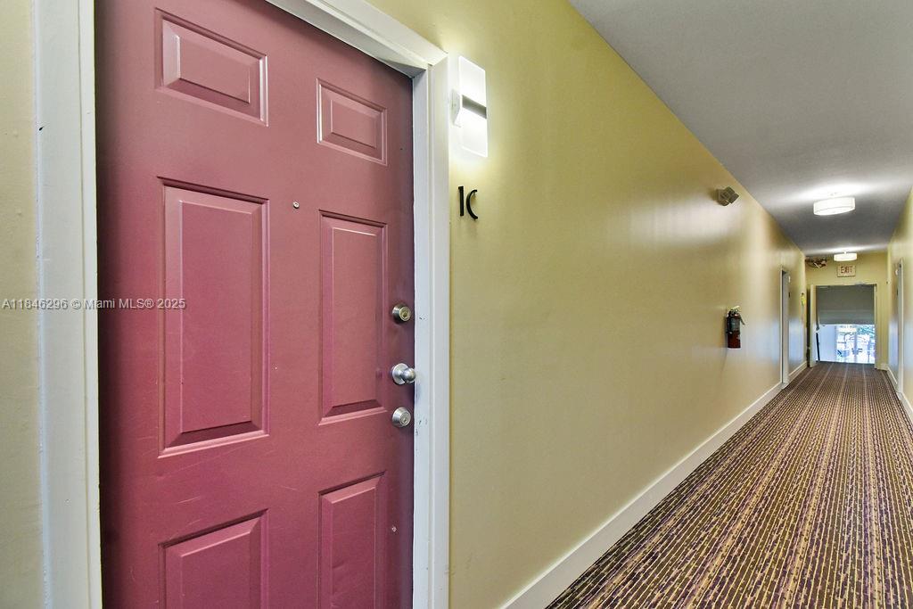 1051 Meridian Avenue, Unit 1C Miami Beach, FL 33139 - Photo 19 of 27 a view of a hallway with wooden floor