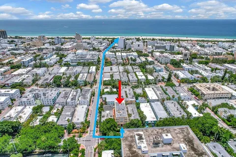 an aerial view of residential building with parking space