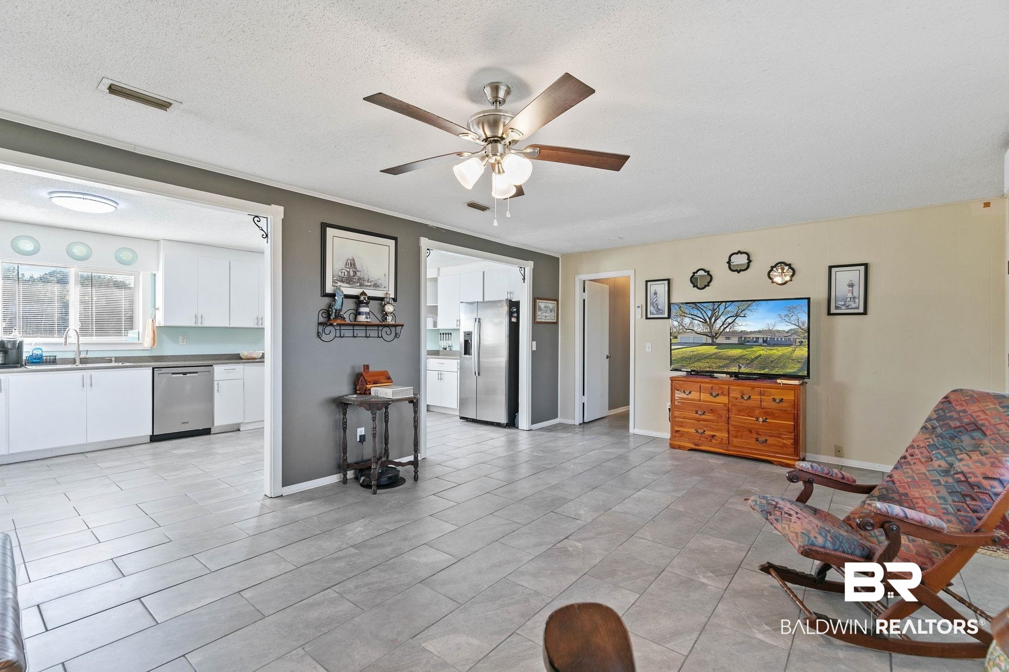 21267 Loop Road Andalusia, AL 36421 - Photo 19 of 72 Living room with a ceiling fan and a textured ceiling