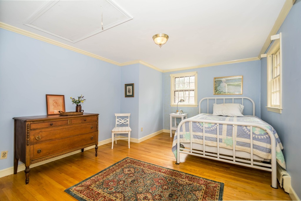96 Middleton Road Boxford, MA 01921 - Photo 20 of 30 a bedroom with a bed and a table in it