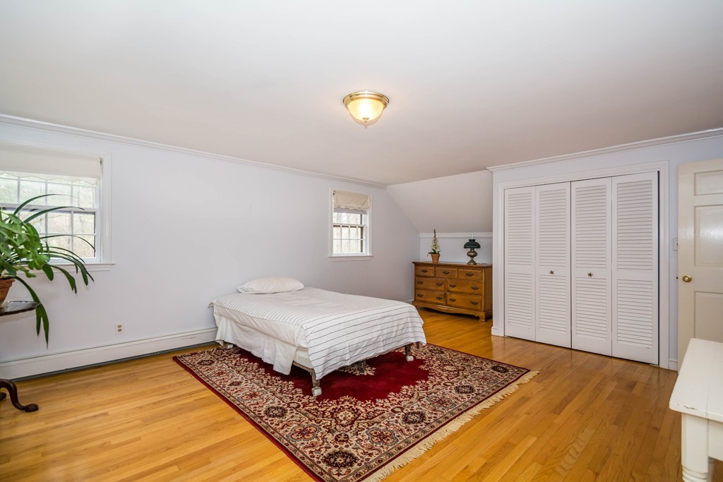 96 Middleton Road Boxford, MA 01921 - Photo 24 of 30 a bedroom with a bed and a view of kitchen