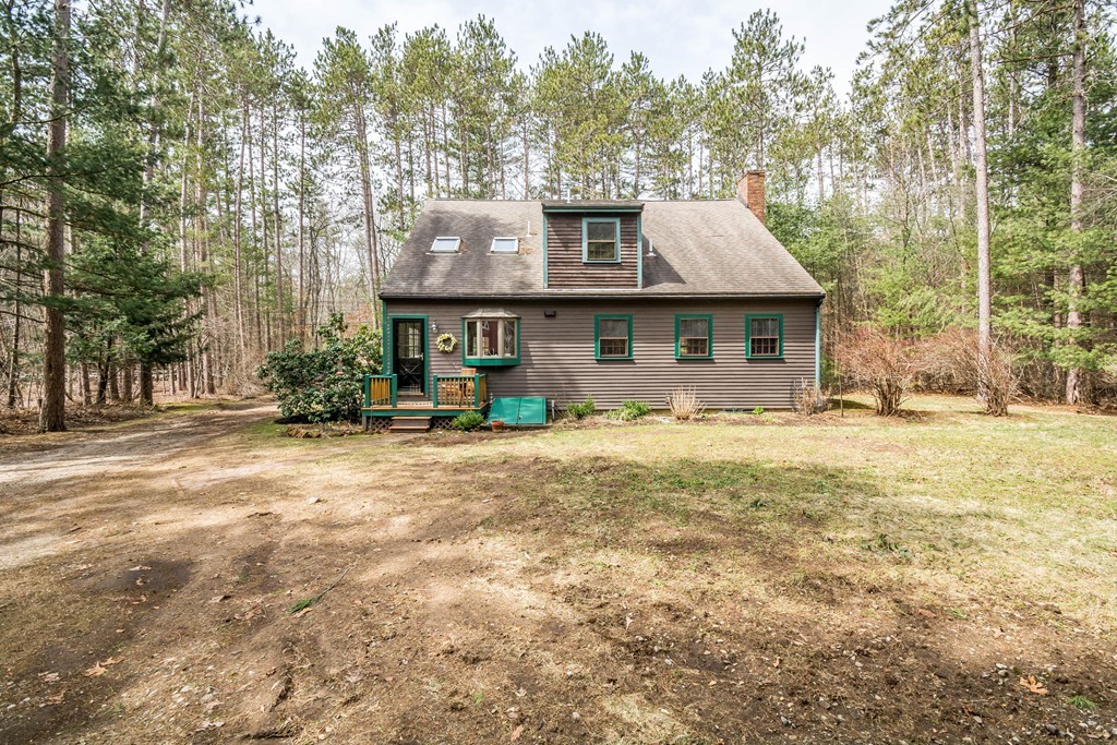 96 Middleton Road Boxford, MA 01921 - Photo 27 of 30 a front view of a house with a yard and large trees