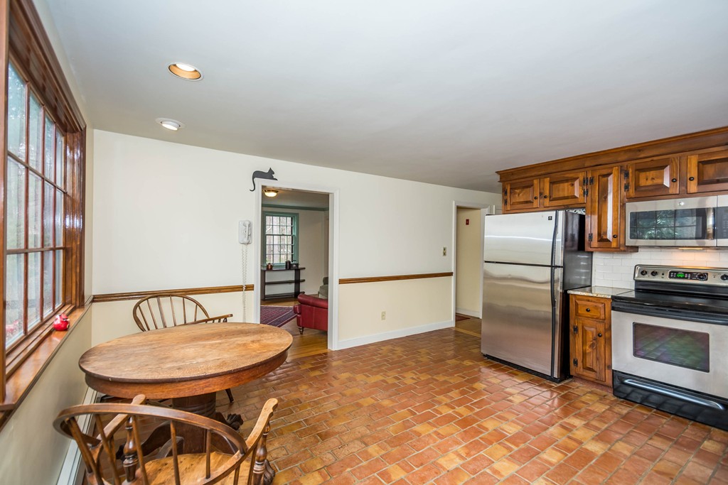 96 Middleton Road Boxford, MA 01921 - Photo 3 of 30 a kitchen with stainless steel appliances a refrigerator and a stove top oven