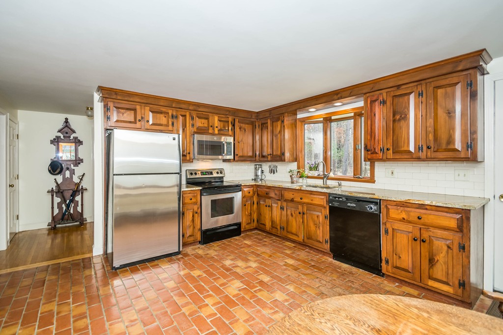 96 Middleton Road Boxford, MA 01921 - Photo 5 of 30 a kitchen with granite countertop stainless steel appliances a refrigerator stove top oven and sink