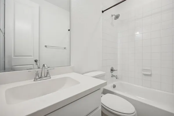 a bathroom with a sink a toilet and a bathtub