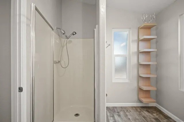 a white toilet sitting next to a bath tub shower