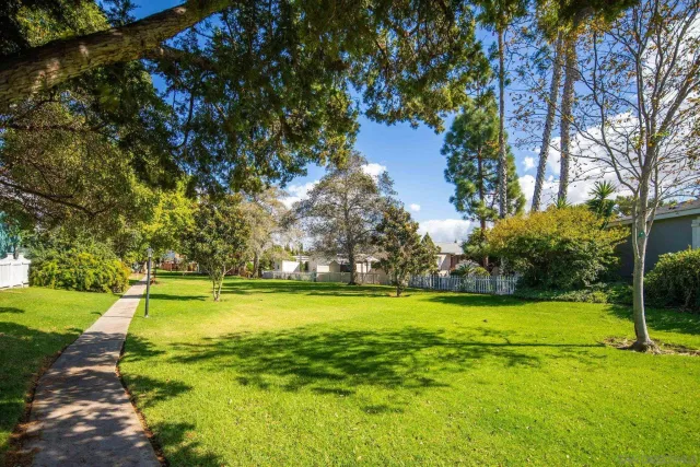 a view of a swimming pool with outdoor seating