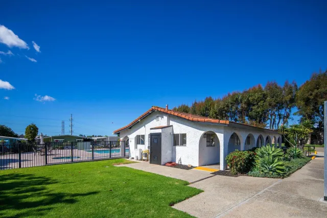 a view of a swimming pool with a lounge chair