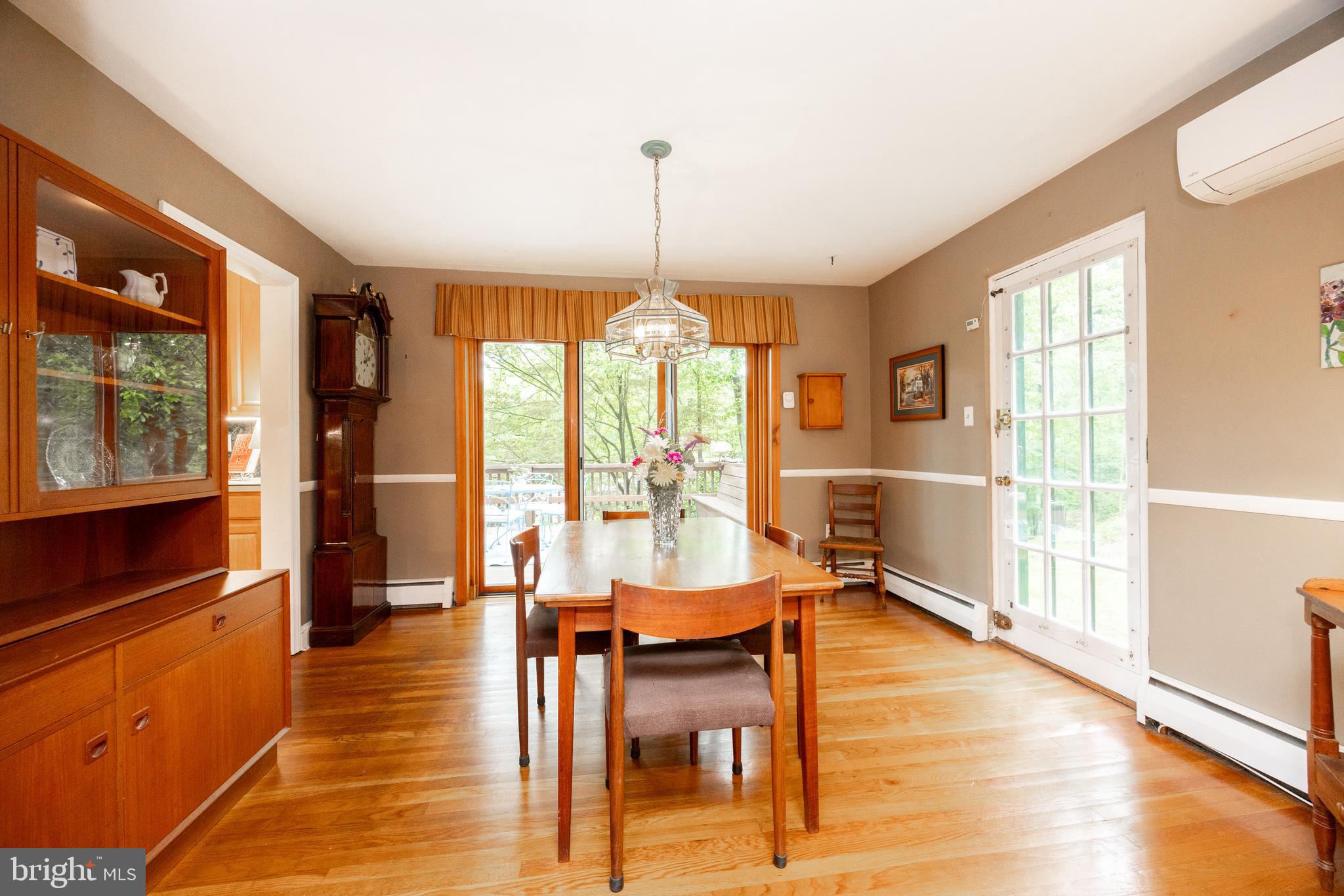 337 Greene Road Berwyn, PA 19312 - Photo 12 of 35 a view of a dining room with furniture window and wooden floor