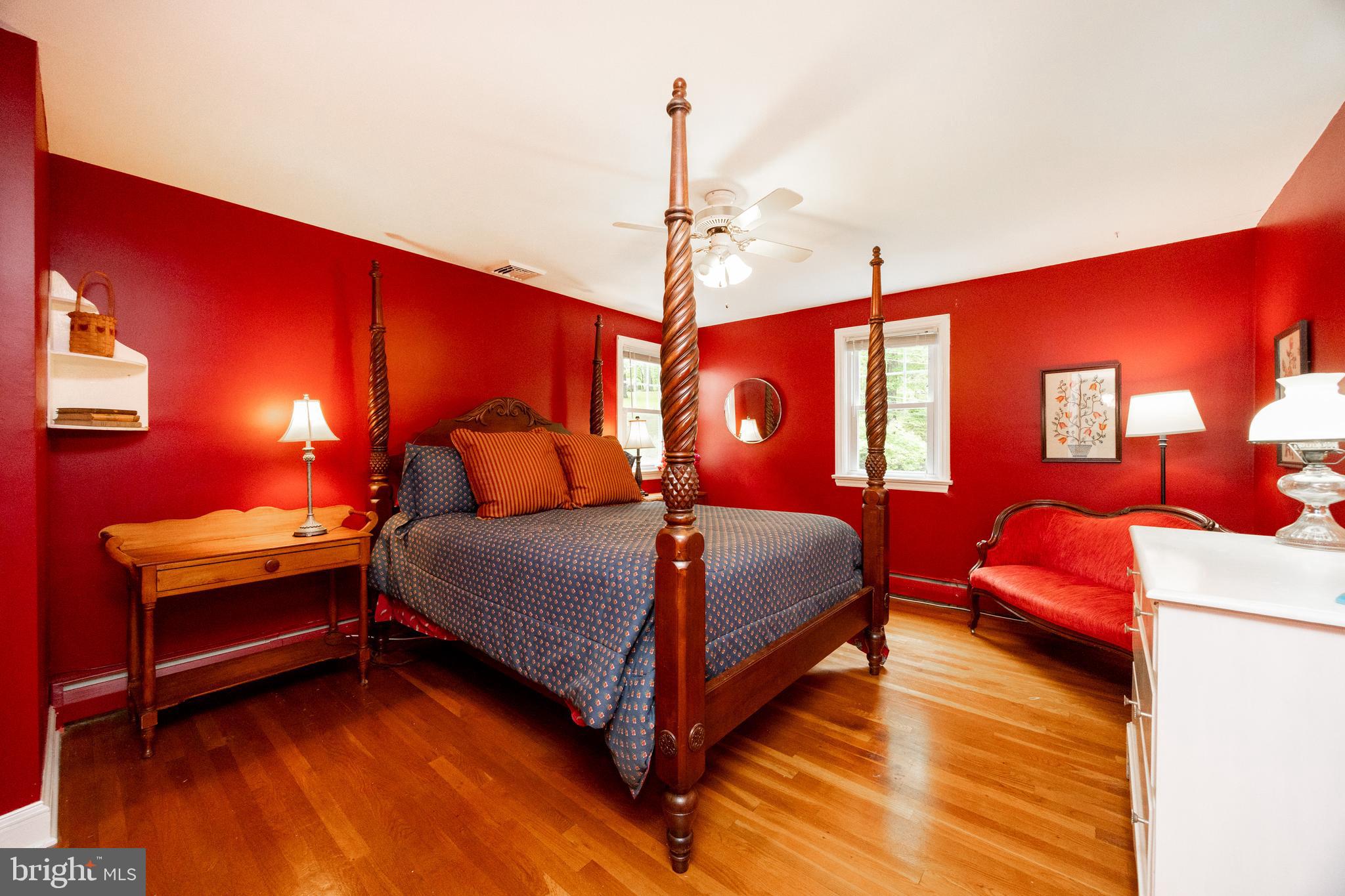 337 Greene Road Berwyn, PA 19312 - Photo 16 of 35 a bedroom with a bed and lamp with the view of living room