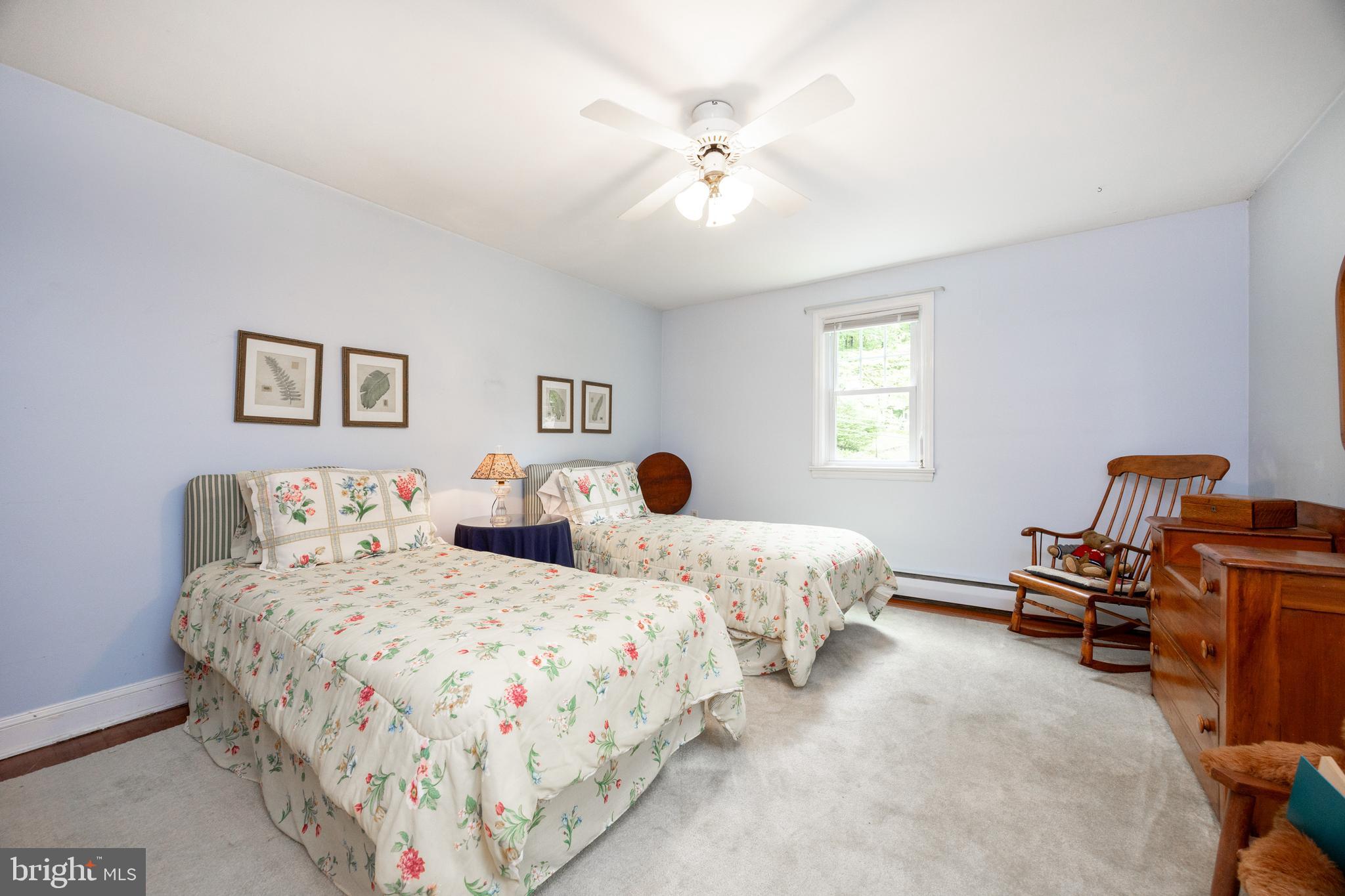 337 Greene Road Berwyn, PA 19312 - Photo 17 of 35 a bedroom with two beds and a chandelier