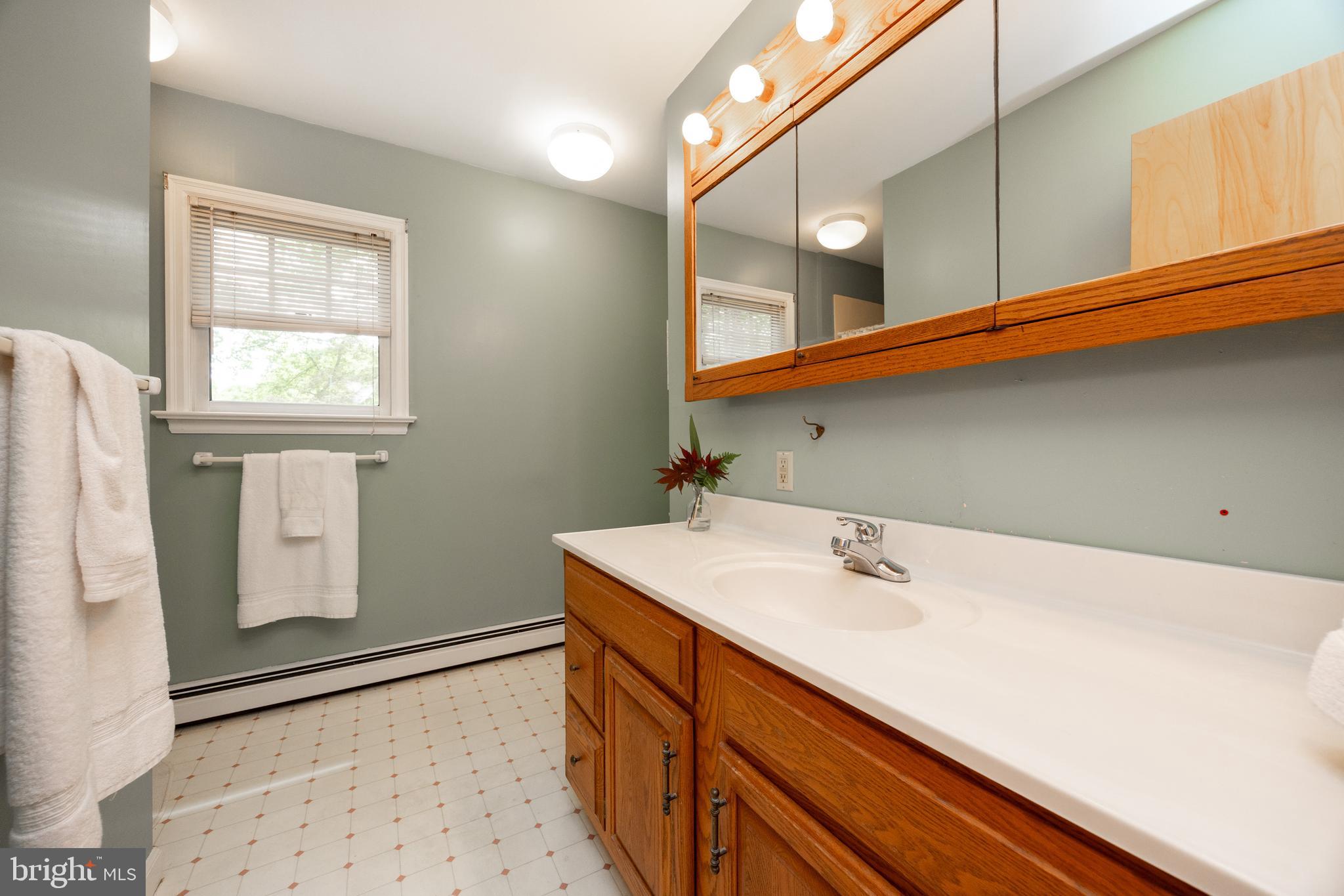 337 Greene Road Berwyn, PA 19312 - Photo 22 of 35 a bathroom with a sink a vanity and a mirror