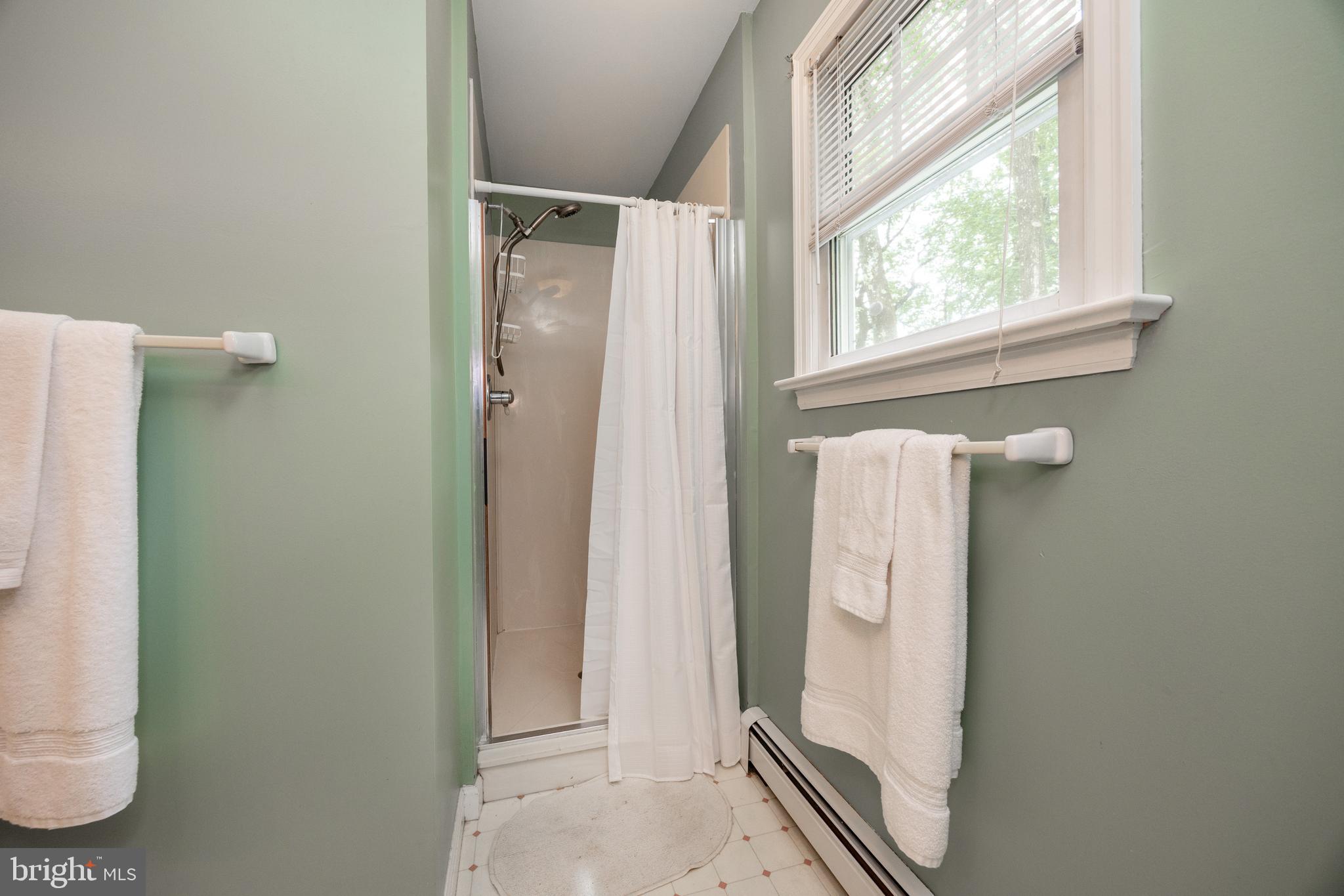 337 Greene Road Berwyn, PA 19312 - Photo 23 of 35 a bathroom with a mirror and a shower