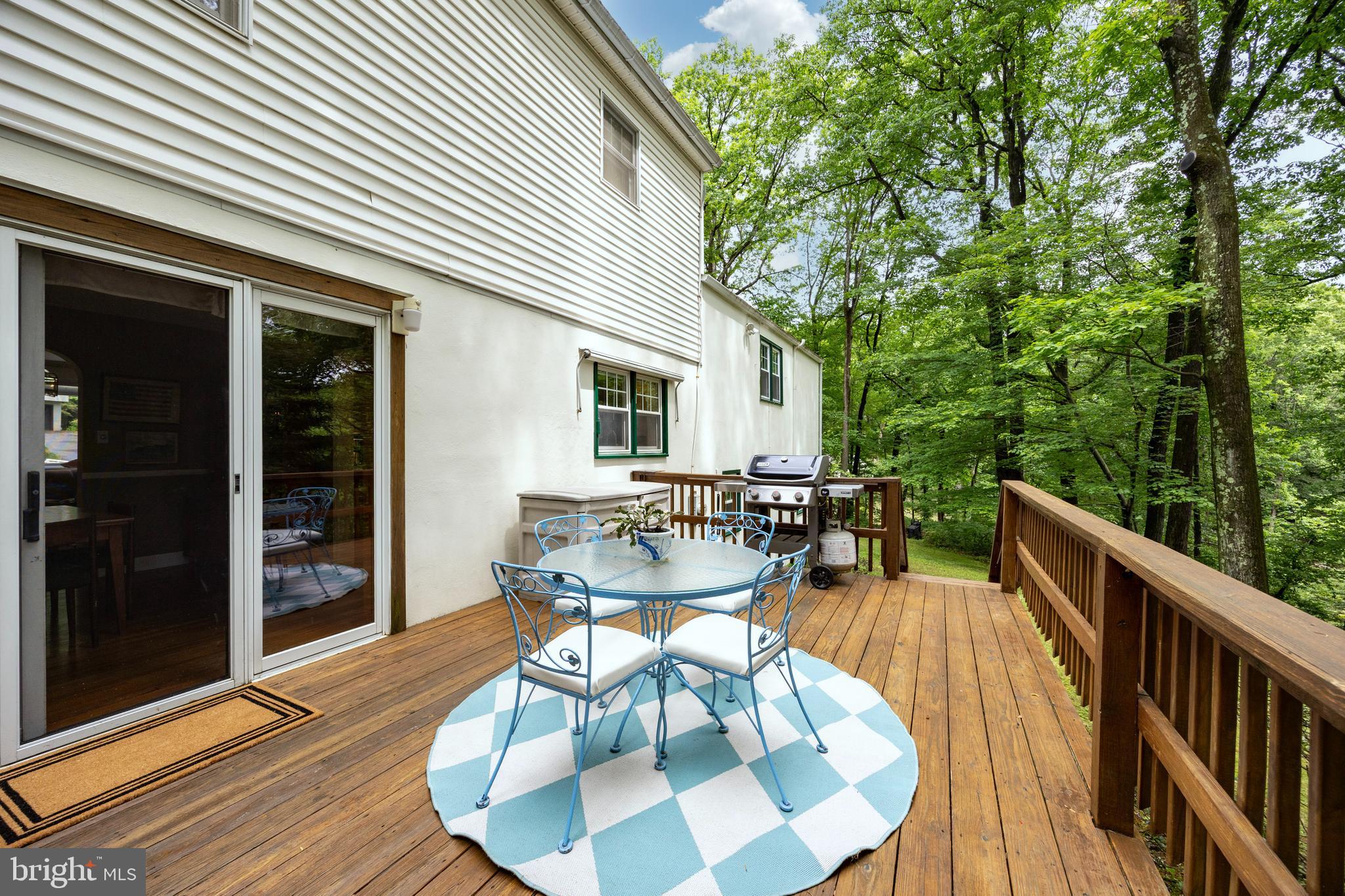 337 Greene Road Berwyn, PA 19312 - Photo 31 of 35 a view of a patio with a dining table and chairs with wooden floor and fence