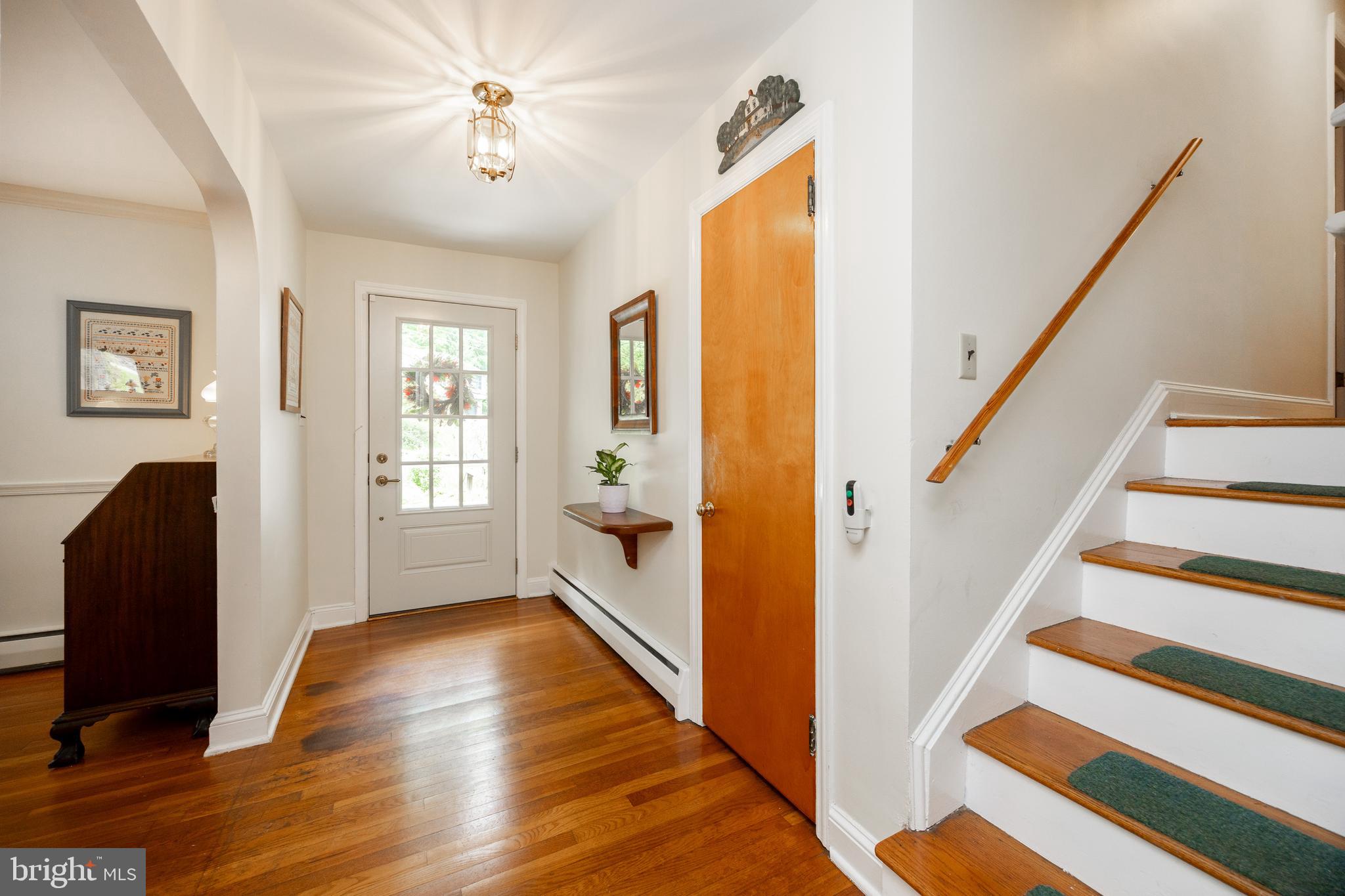 337 Greene Road Berwyn, PA 19312 - Photo 6 of 35 a view of a livingroom with wooden floor and a ceiling fan