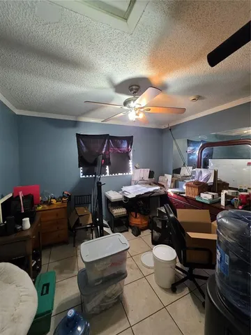 a room with gym equipment and a wooden floor