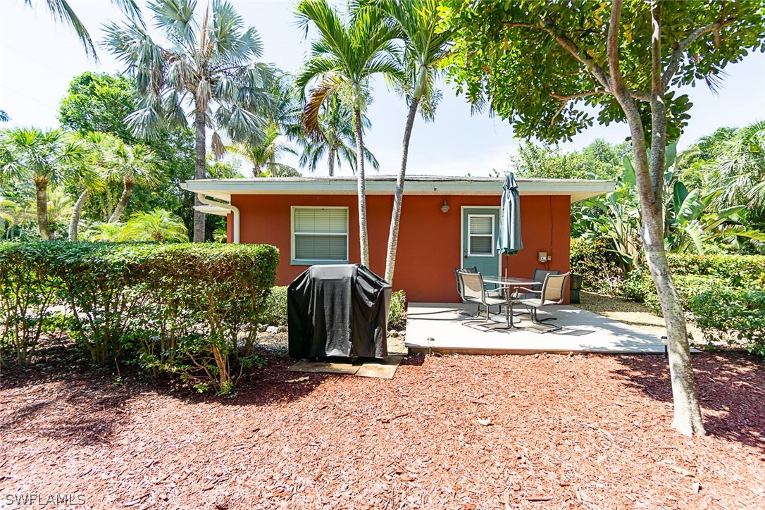 849 Beach Road Sanibel, FL 33957 - Photo 13 of 14 a view of house with backyard and trees around