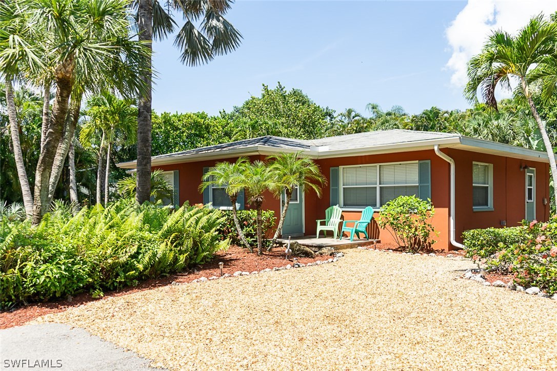 849 Beach Road Sanibel, FL 33957 - Photo 14 of 14 a view of a house with backyard and garden