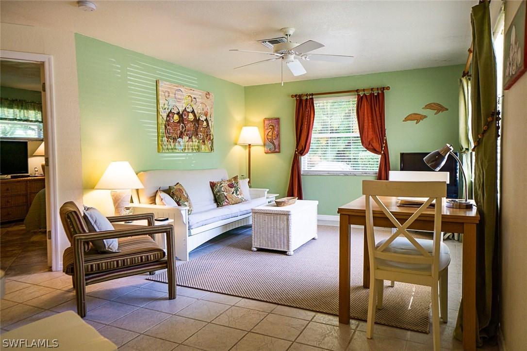 849 Beach Road Sanibel, FL 33957 - Photo 6 of 14 a living room with furniture and a window
