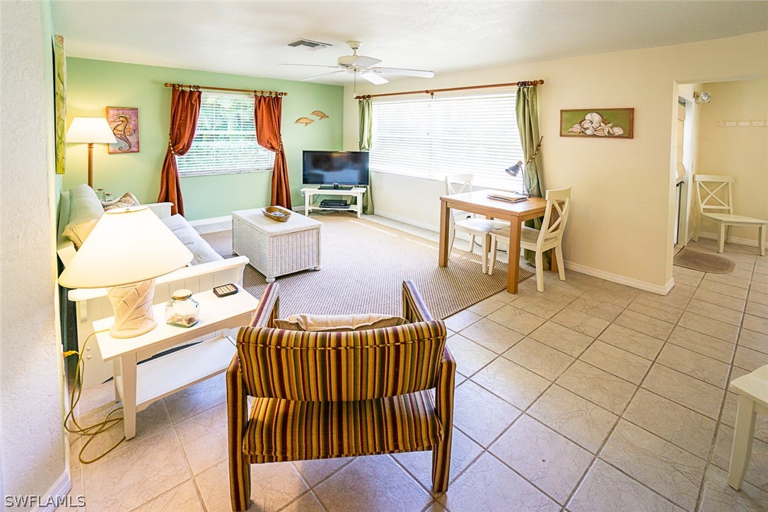 849 Beach Road Sanibel, FL 33957 - Photo 7 of 14 a living room filled with furniture