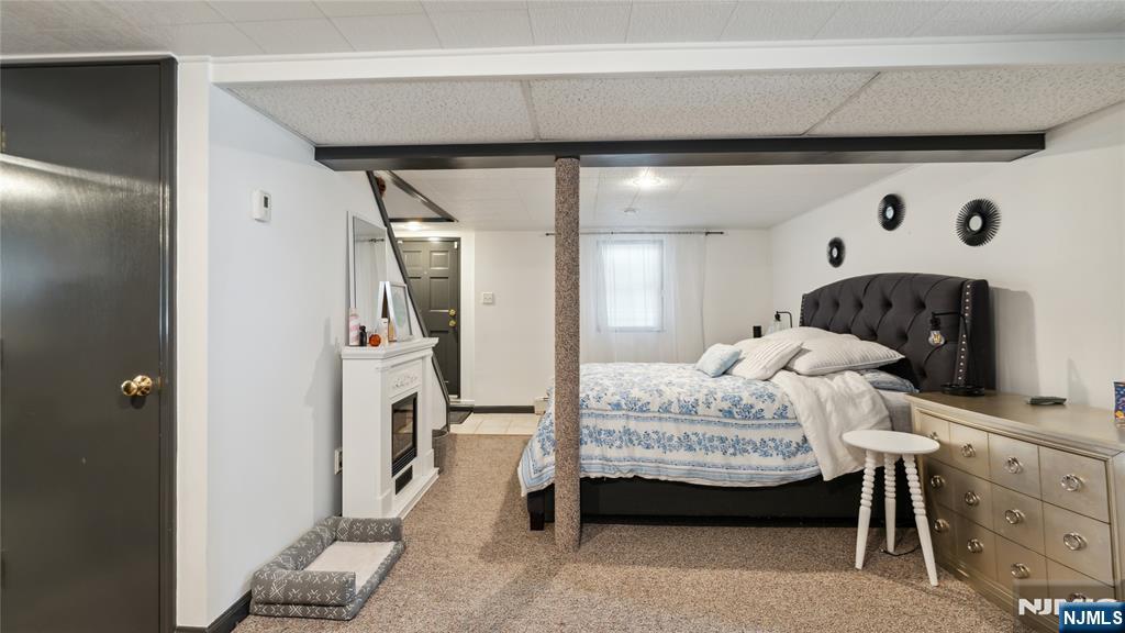 80 Union Avenue Little Ferry, NJ 07643 - Photo 15 of 35 a bedroom with a bed and a mirror