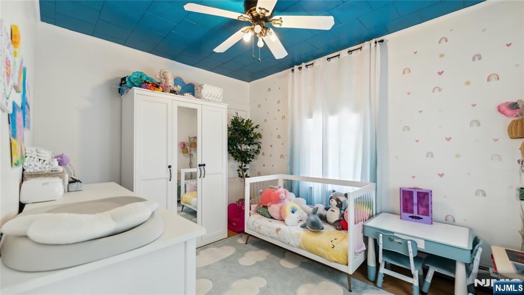 80 Union Avenue Little Ferry, NJ 07643 - Photo 16 of 35 a bedroom with furniture and a bed