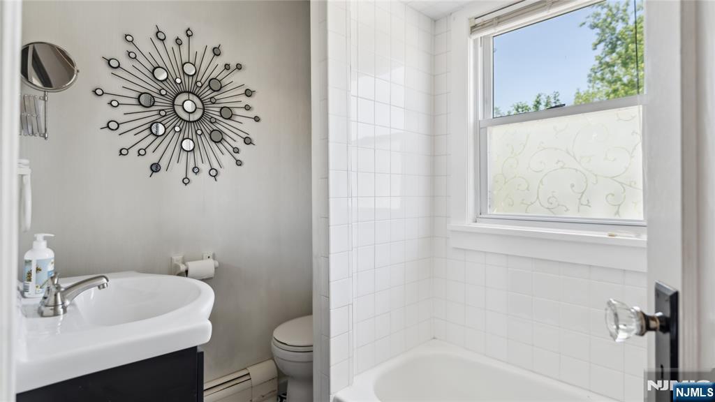 80 Union Avenue Little Ferry, NJ 07643 - Photo 17 of 35 a bathroom with a toilet sink and mirror